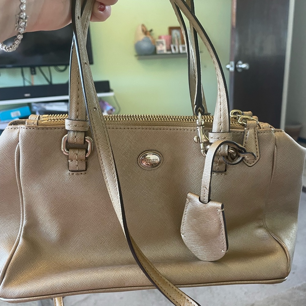 Gold coach bag